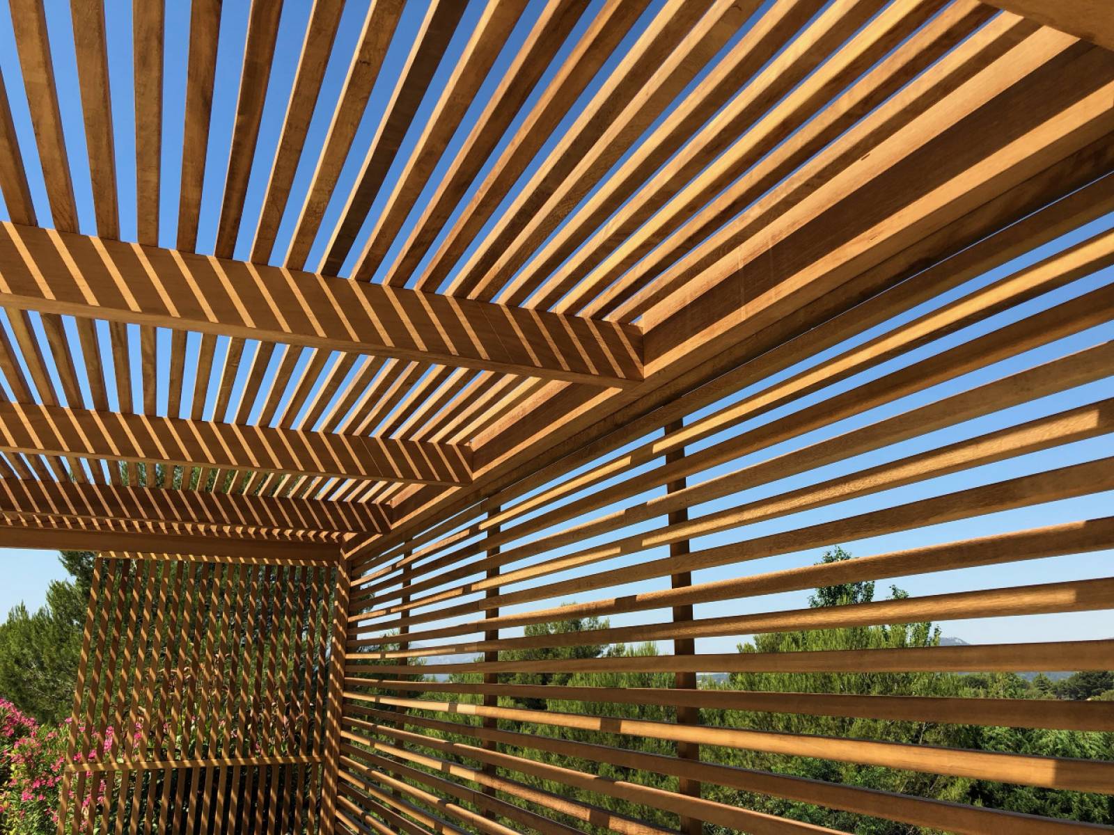 Image of pergola slats up-close showing how shadows affect a space.