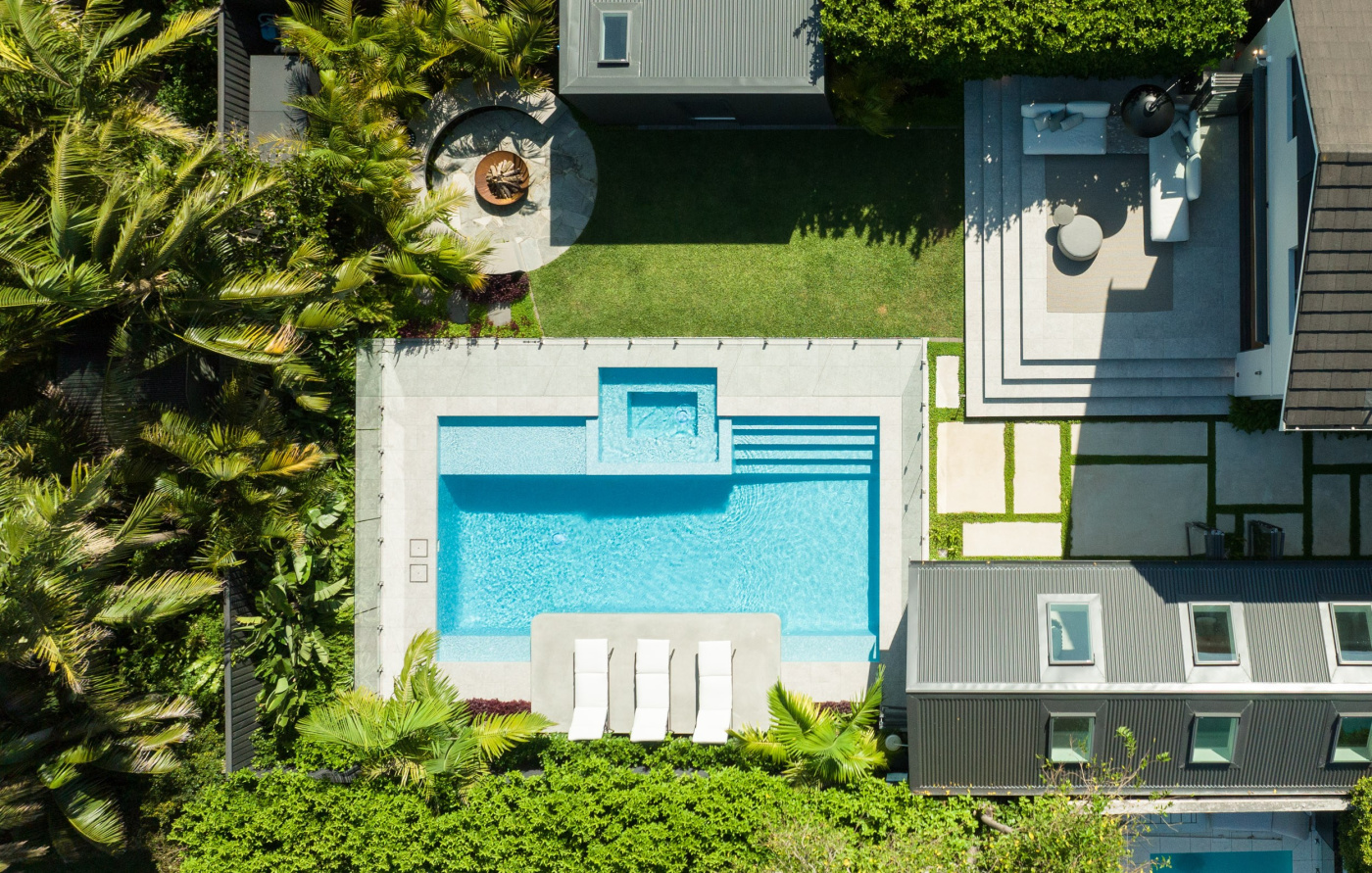 Rolling Stone Landscapes backyard view from birds eye view showcasing pool and patio layout