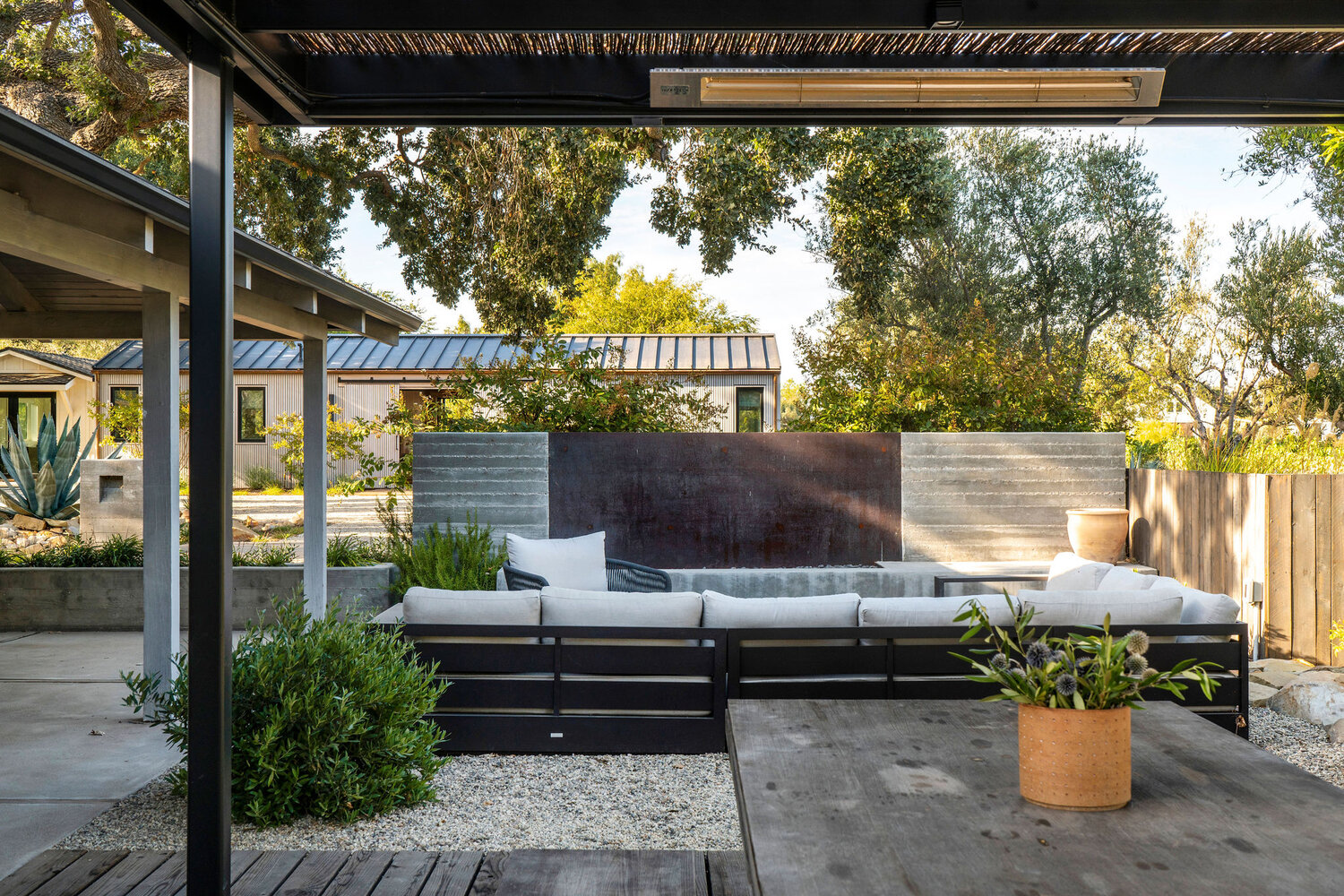 bosky landscape architecture includes outdoor seating areas within the landscape