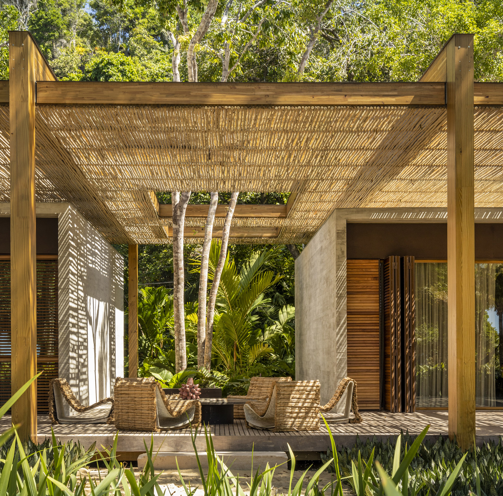 Studio MK27 Covers Brazilian Home with Rustic Eucalyptus Pergola