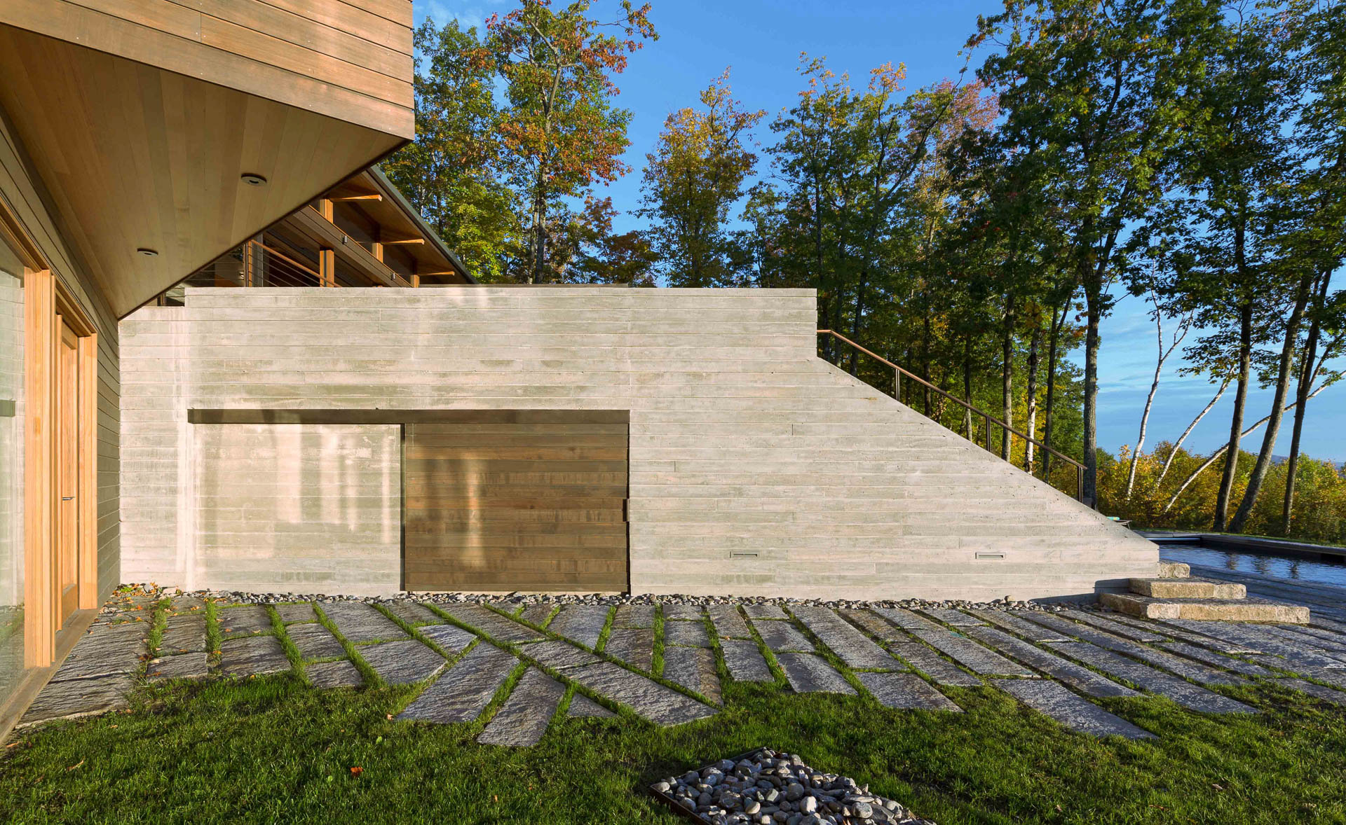 Matthew Cunningham Landscape Design uses board formed concrete to create terraces located near steep slopes.