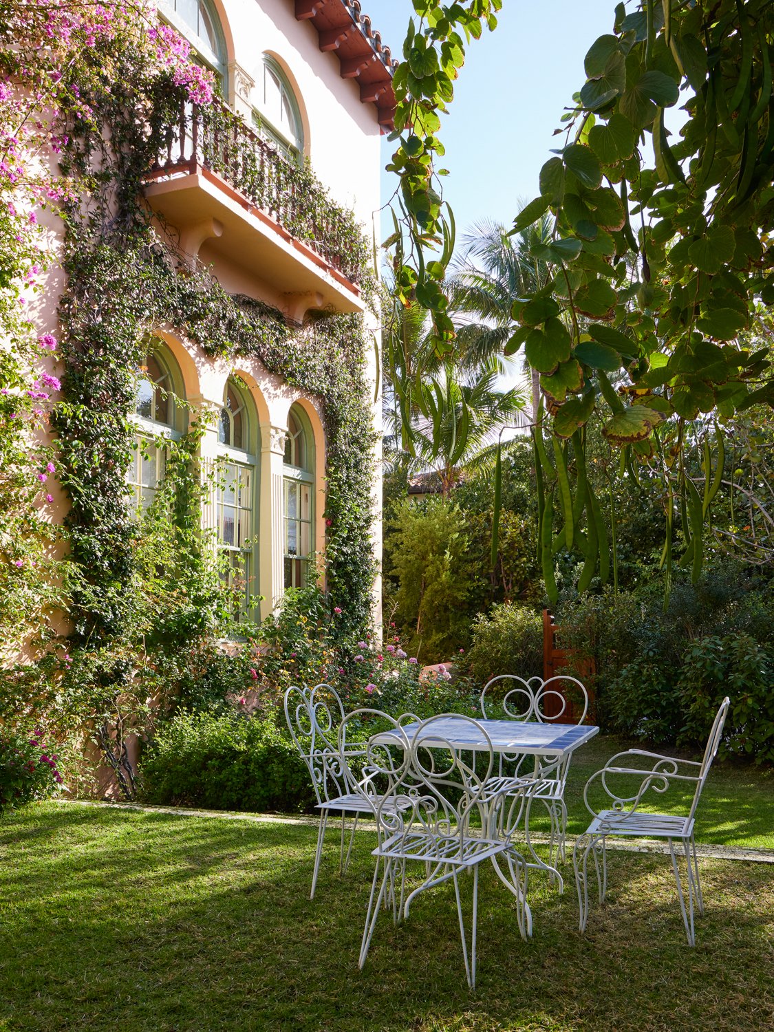 One of the standout features of the exterior of the home is the facade covered in ivy and Bougainvillea.